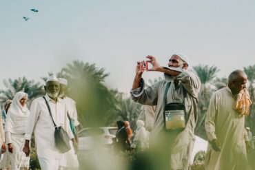 a man taking a picture of a group of people